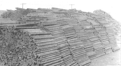 Piles of heavily rusted bars