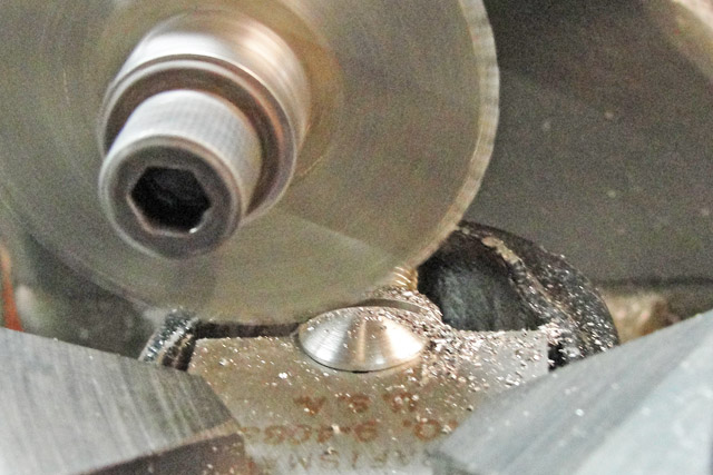 Last cut during the slotting of one of the finished screws